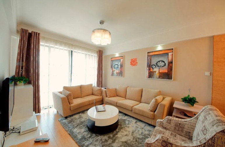 现代风格暖色系客厅装修效果图